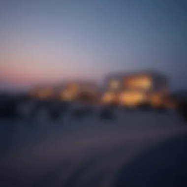 A tranquil evening scene featuring illuminated dune homes reflecting the lifestyle benefits of residing near sand dunes.