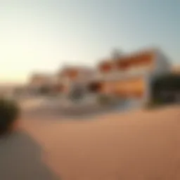 A panoramic view of luxurious dune properties in Dubai showcasing unique architecture against a desert backdrop.